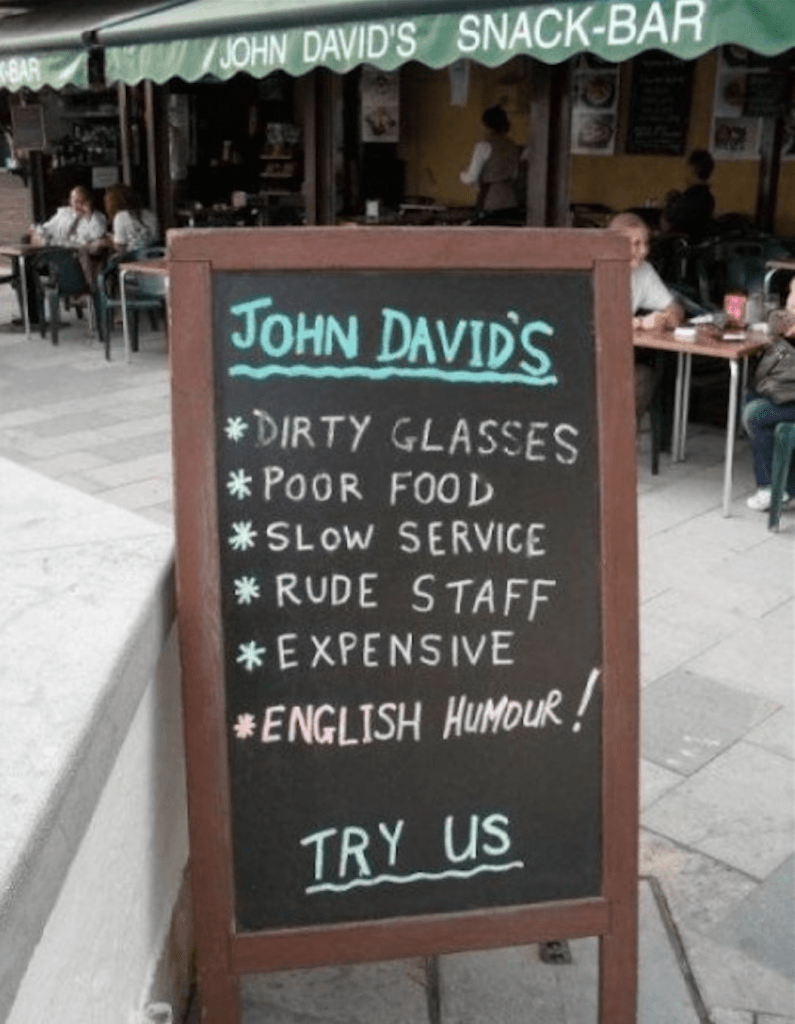 Get it? English humor on a sandwich board.